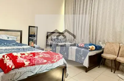 شقة - غرفة نوم - 2 حمامات للبيع في أورينت تاور 1 - أورينت تاور - البستان - عجمان